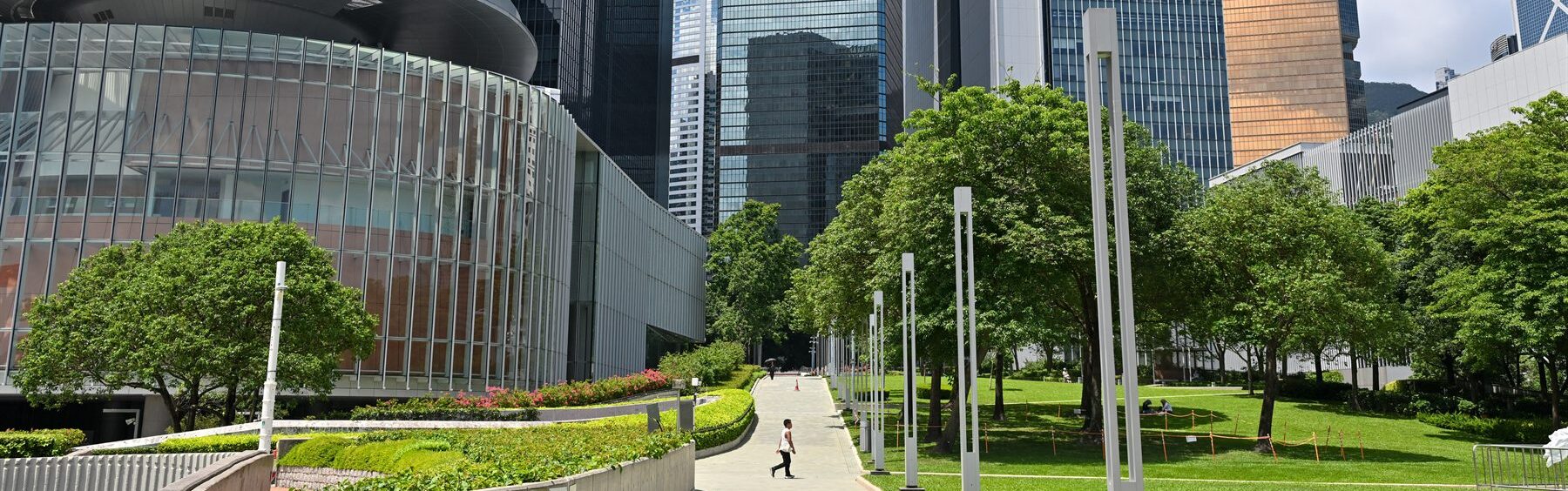 Hong Kong government complex with a walkway and greenery