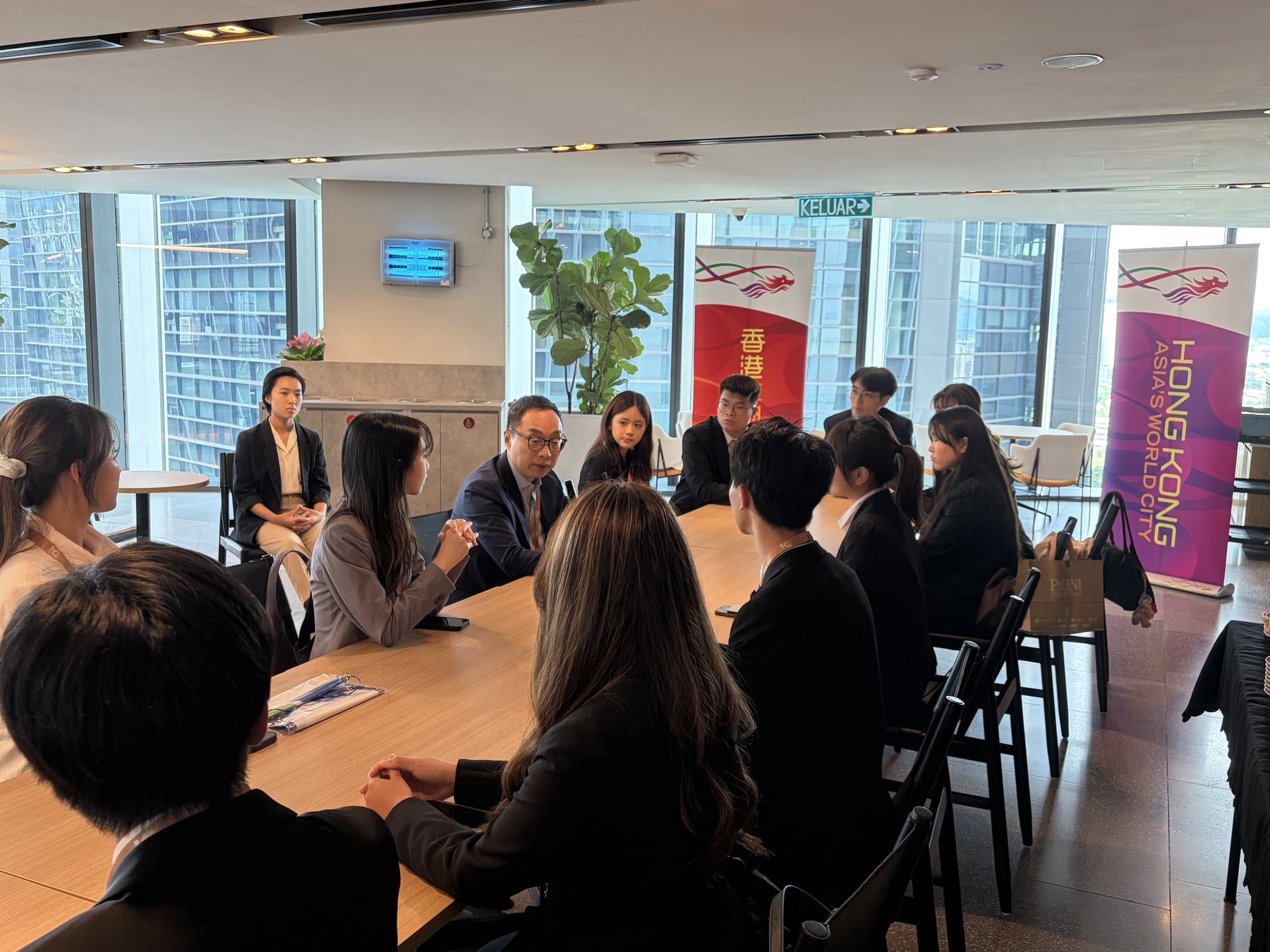 Hong Kong Metropolitan University student ambassadors attending an office briefing